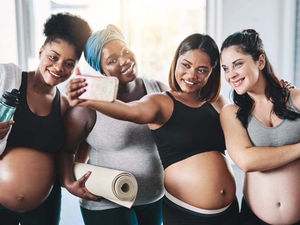 A stock photo of a group of young pregnant women.