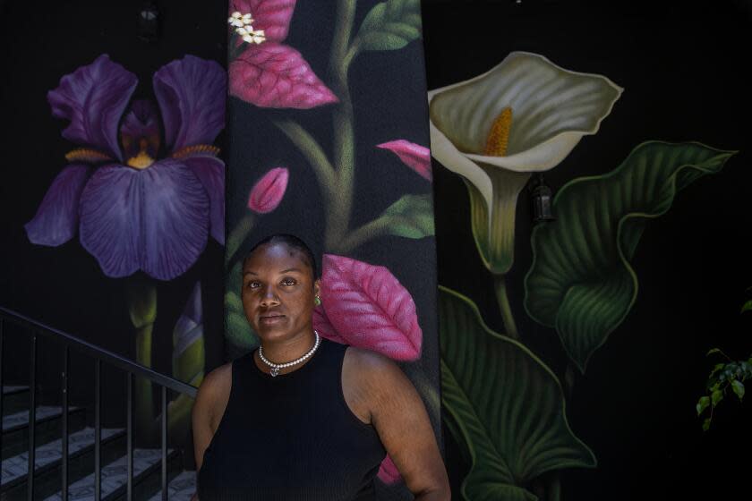 BOYLE HEIGHTS, CA-JULY 7, 2023: Zahria Eaves, a resident at the Dunamis House, which houses young people, including college/trade school students, experiencing homelessness in Boyle Heights, is photographed inside the courtyard, where she likes to spend a lot of her time. (Mel Melcon / Los Angeles Times)