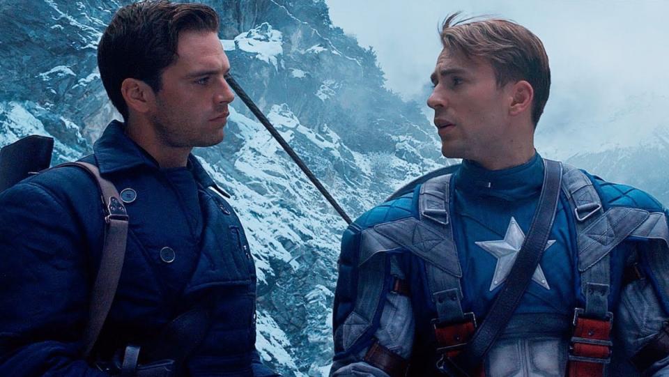 photo of Captain America and Bucky standing together and talking on mountain in the first avenger film