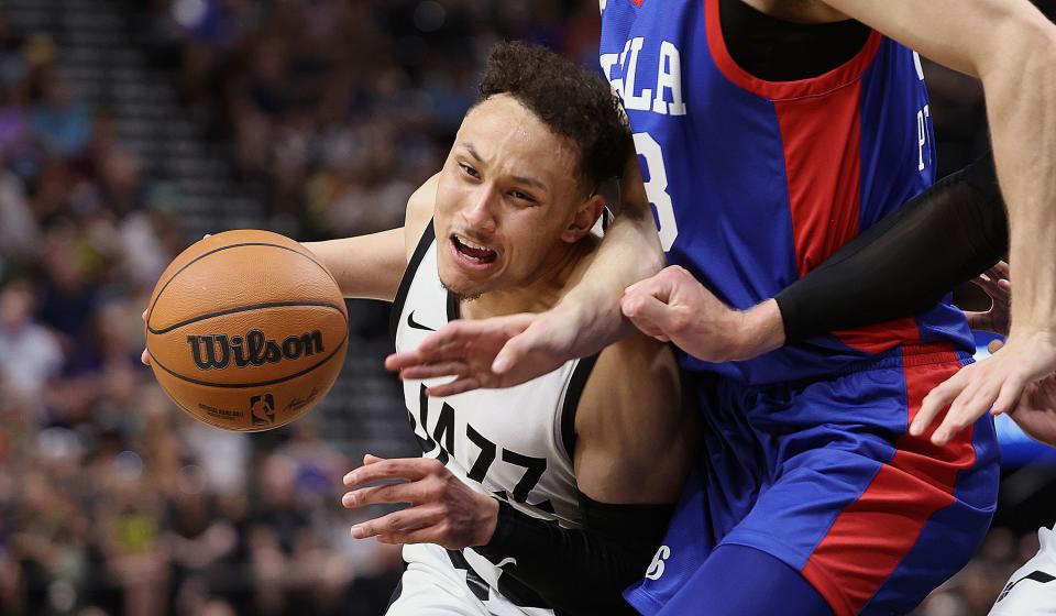 Utah Jazz guard Colbey Ross (44) is fouled by Philadelphia 76ers center Filip Petrusev (33) as the Utah Jazz and Philadelphia 76ers play in Summer League action at the Delta Center in Salt Lake City on Wednesday, July 5, 2023. 76ers won 104-94. | Scott G Winterton, Deseret News