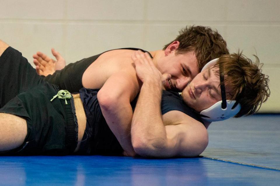 Gabe Beeman taps out as he practices with Jared Barr during Ocean Springs’ high school wrestling practice at E.H. Keys Alternative Education Center on Thursday, Feb. 8, 2024.