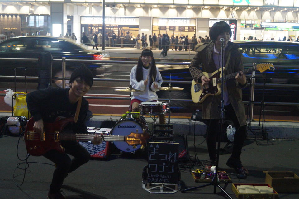 <p>A teen rock band performs outside Shinjuku Station in Tokyo. (Photo: Michael Walsh/Yahoo News) </p>