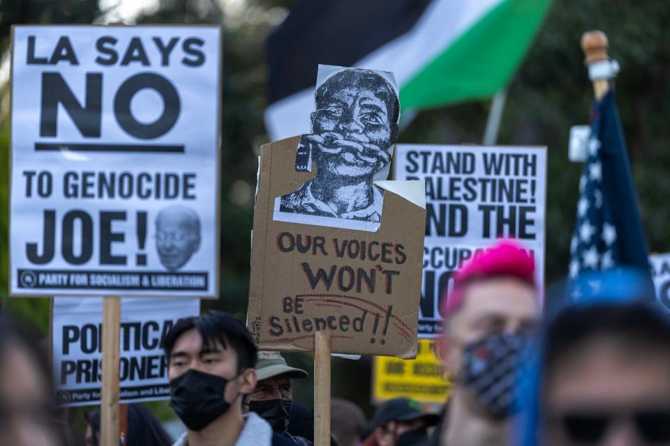 Protesters denounce the Biden administration's support of Israel, which has killed thousands of Palestinian civilians so far in its war against Hamas in Gaza, on December 8, 2023 in Los Angeles, California.