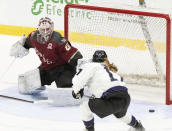 Minnesota's Brooke Bryant (17) scores on Montreal goaltender Elaine Chuli (20) during the second period of a PWHL hockey game Thursday, April 18, 2024, in Montreal. (Christinne Muschi/The Canadian Press via AP)