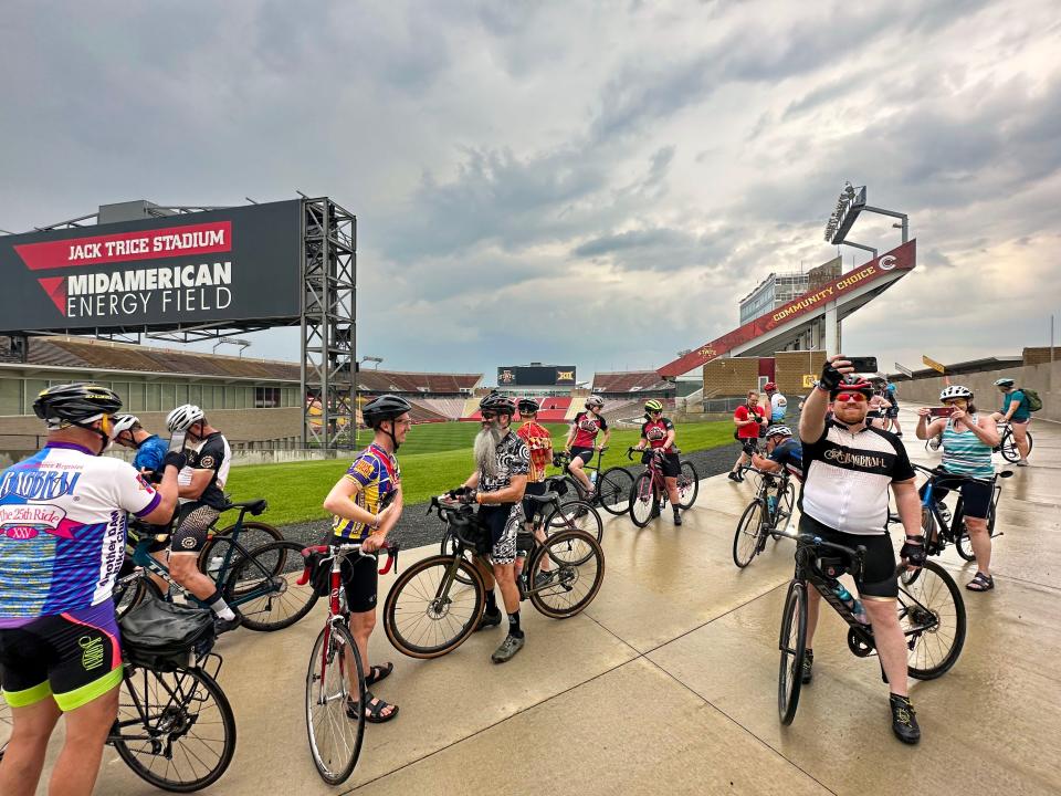 Members of the RAGBRAI route inspection team ride a lap round the inside of Jack Trice Stadium in Ames on Tuesday.