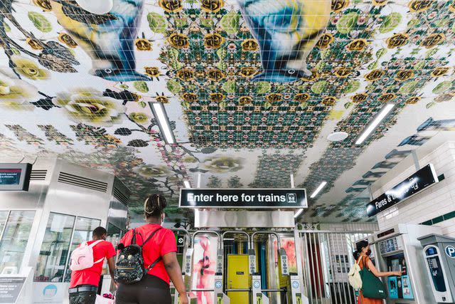 Lucy Hewett Tiles by Nick Cave and Bob Faust decorate the Garfield subway station ceiling.