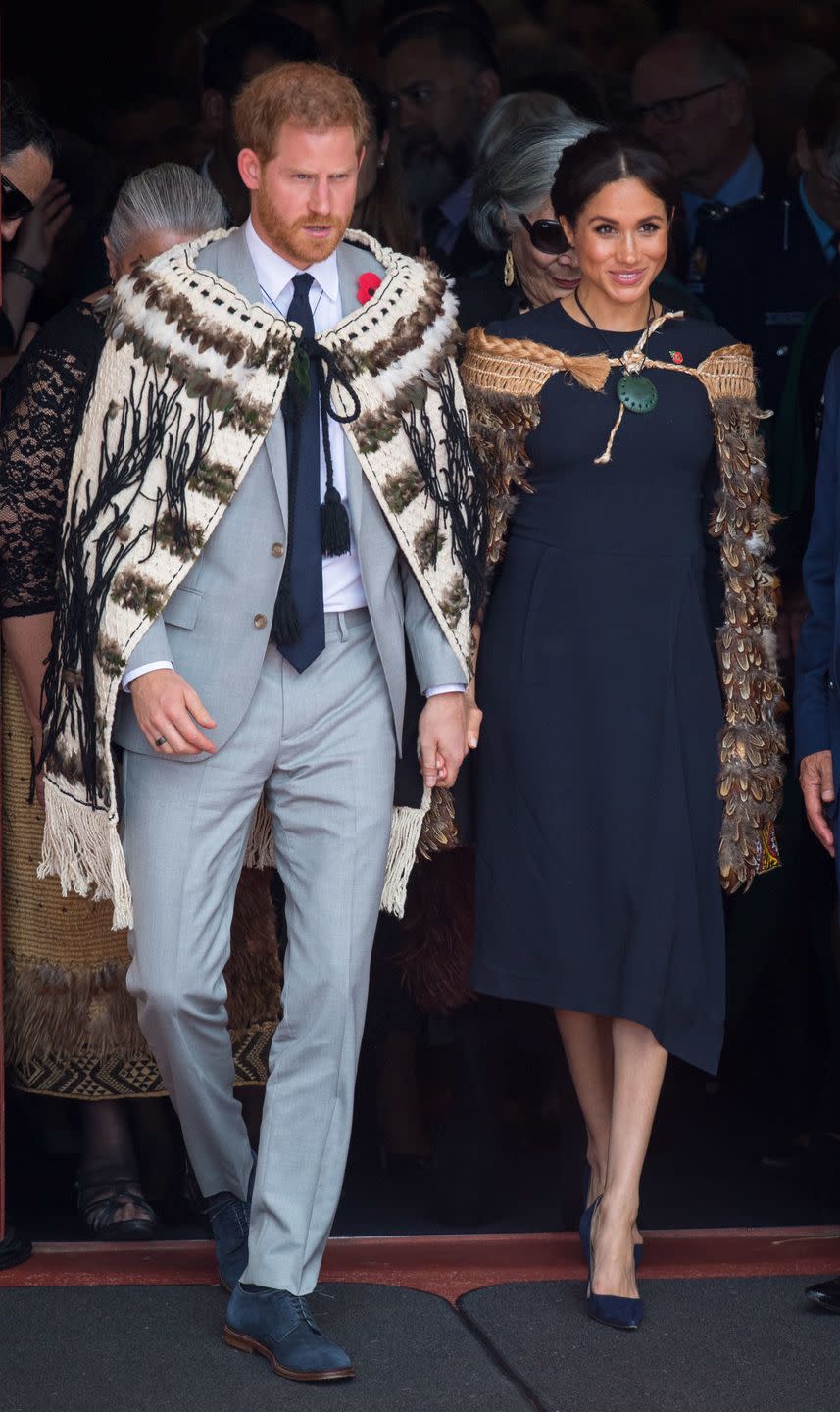 <p>Both royals <a href="https://www.townandcountrymag.com/style/fashion-trends/a24450173/meghan-markle-stella-mccartney-navy-midi-dress-final-day-royal-tour-new-zealand/" rel="nofollow noopener" target="_blank" data-ylk="slk:wore traditional Maori cloaks;elm:context_link;itc:0;sec:content-canvas" class="link ">wore traditional Maori cloaks</a> to the welcome ceremony, which is called a powhiri. </p>