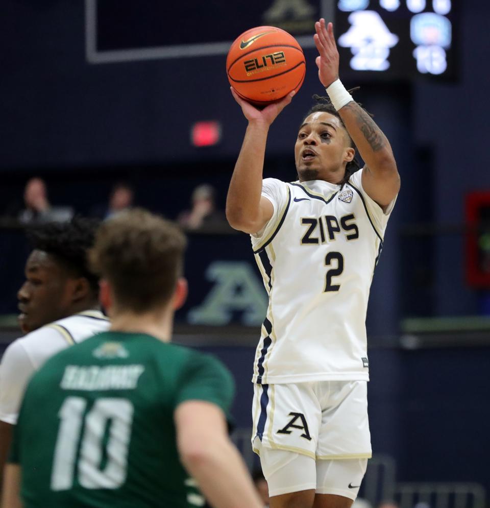 Akron guard Greg Tribble shoots during the first half against Ohio on Tuesday in Akron.