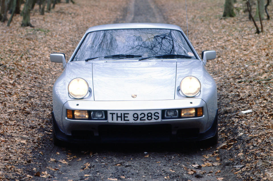 <p>It was (<strong>European) Car of the Year</strong> in 1978 and it was intended to replace the 911, but the 928 failed in its mission despite its technical wizardry. A front-mounted V8 was mated to a transaxle for better packaging and weight distribution. The bodyshell was galvanised and the body-coloured plastic bumpers were flush but the cost was too high and the 911 continued to outsell the 928 by a huge margin. Production of the 928 lasted for 18 years but only <strong>61,000</strong> or so examples were made in that time.</p>