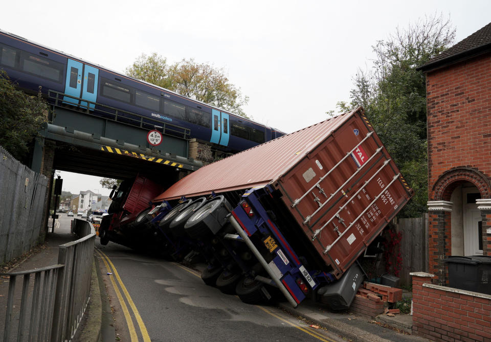 An articulated lorry which hit a bridge in Coombe Valley Road, Dover, this morning. The lorry was left on its side after the collision.