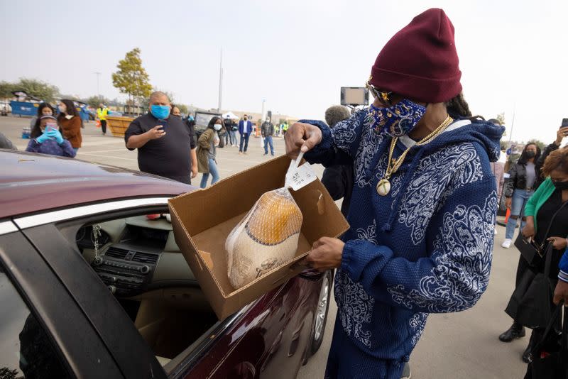 Rapper Snoop Dog helps at Thanksgiving Turkey Giveaway in Inglewood, California