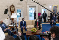 From left, President Joe Biden, Transportation Secretary Pete Buttigieg, House Transportation and Infrastructure Committee Ranking Member Rep. Sam Graves, R-Mo., Rep. Brian Fitzpatrick, R-Pa., Highways and Transit Subcommittee Ranking Member Rep. Rodney Davis, R-Ill., and other members of the House of Representatives meet in the Oval Office of the White House in Washington, Thursday, March 4, 2021, on infrastructure. (AP Photo/Andrew Harnik)