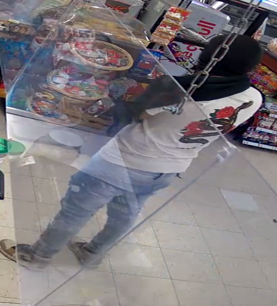 One of the two "cookie robbers" wore a T-shirt with snake and flowers on its back during the robbery at El Fandango grocery store on Olive Avenue in South El Paso.