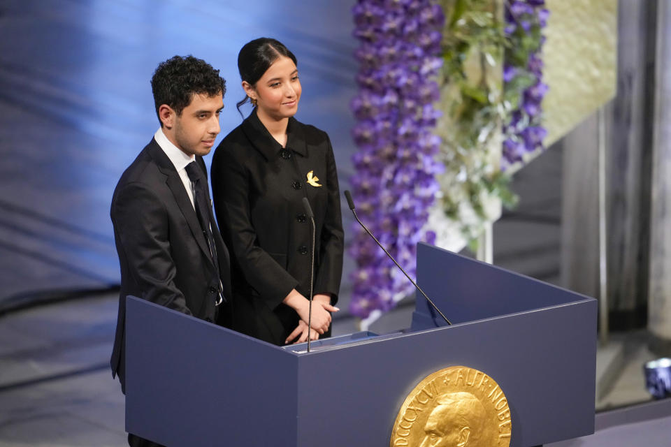 Kiana Rahmani, right, and Ali Rahmani attend the awarding of the Nobel Peace Prize for 2023 in Oslo City Hall, Oslo, Norway, Sunday, Dec. 10, 2023. The children of imprisoned Iranian activist Narges Mohammadi, Ali Rahmani and Kiana Rahmani are to accept this year’s Nobel Peace Prize on her behalf. Mohammadi is renowned for campaigning for women’s rights and democracy in her country. (Fredrik Varfjell/NTB via AP)