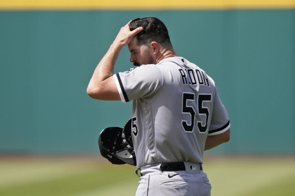 Chicago White Sox starting pitcher Carlos Rodon reacts after giving up a solo home run to Cleveland Indians' Amed Rosario in the first inning of the first baseball game of a doubleheader, Monday, May 31, 2021, in Cleveland. (AP Photo/Tony Dejak)