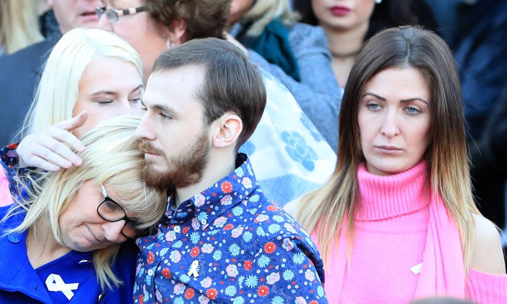 Jack Sargeant comforts his mother Bernie at this father’s funeral