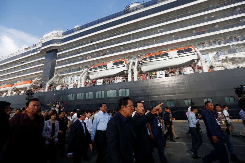 Cambodia's Prime Minister Hun Sen welcomes passenger of MS Westerdam, a cruise ship that spent two weeks at sea after being turned away by five countries over fears that someone aboard might have the coronavirus, as it docks in Sihanoukville
