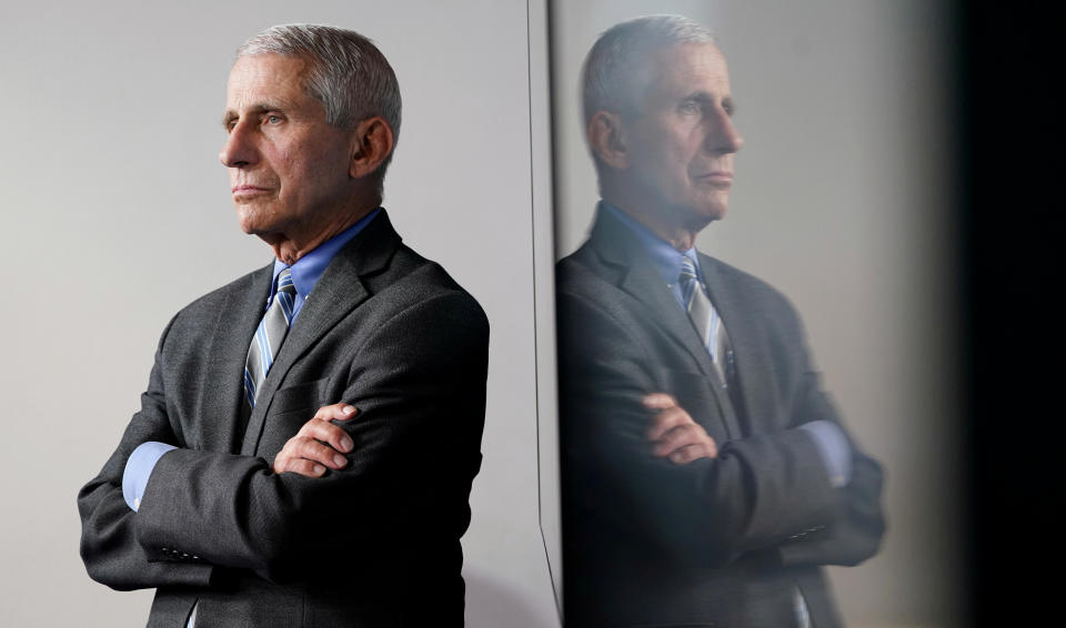 National Institute of Allergy and Infectious Diseases Director Dr. Anthony Fauci is reflected in a video monitor behind him on stage as he listens to the daily coronavirus task force briefing at the White House in Washington, U.S., April 8, 2020. (Kevin Lamarque/Reuters)
