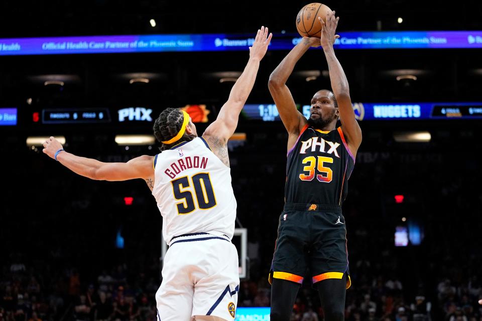 Phoenix Suns forward Kevin Durant (35) shoots over Denver Nuggets forward Aaron Gordon (50) during the first half of Game 4 of an NBA Western Conference semifinal game, May 7, 2023, in Phoenix.