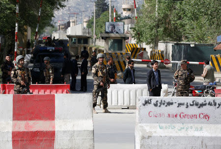 Afghan security forces stand guard near the site of a blast in Kabul, Afghanistan April 30, 2018. REUTERS/Omar Sobhani