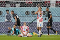 Croatia's Andrej Kramaric, center, and Borna Sosa, second right, gesture during the World Cup group F soccer match between Croatia and Canada, at the Khalifa International Stadium in Doha, Qatar, Sunday, Nov. 27, 2022. (AP Photo/Martin Meissner)