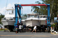 <p>Workers put boats on blocks in preparation, as Hurricane Irma, barreling towards the Caribbean and the southern United States, in San Juan, Puerto Rico, Sept. 4, 2017. (Photo: Alvin Baez/Reuters) </p>