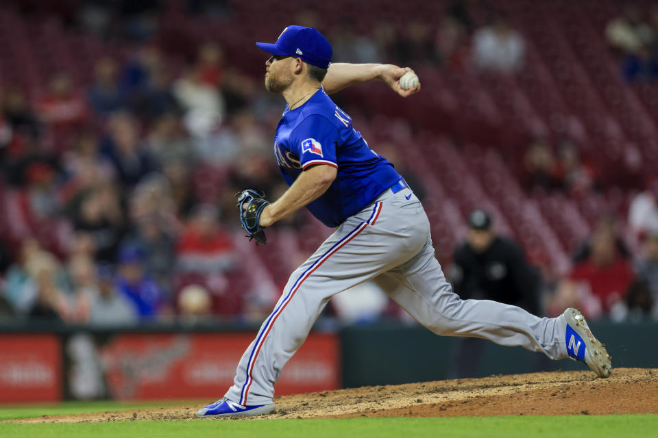 Texas Rangers' Ian Kennedy throws during the eighth inning of the team's baseball game against the Cincinnati Reds in Cincinnati, Tuesday, April 25, 2023. The Reds won 7-6. (AP Photo/Aaron Doster)