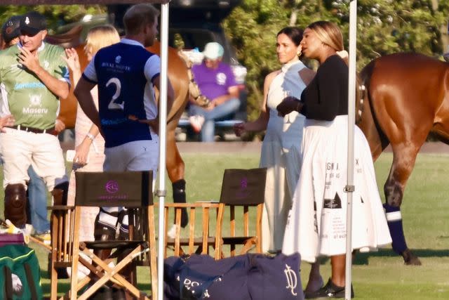 <p>BACKGRID </p> Meghan Markle and Serena Williams speak with Prince Harry at the Royal Salute Polo Challenge in Florida on April 12