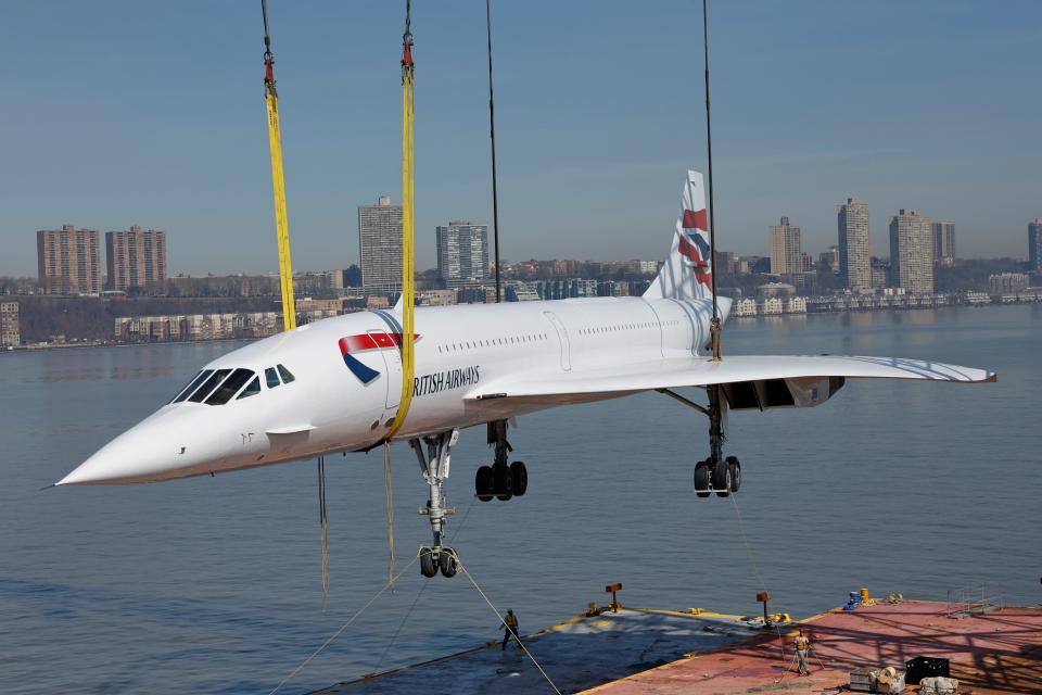 A retired British Airways Concorde supersonic airliner is lifted by a crane as it is returned to the Intrepid Museum on March 14, 2024 in New York City.