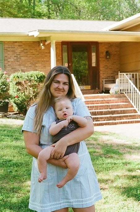 Maggie Hohne holds her son, August. She speaks about the challenges of parenting a child with a rare condition.