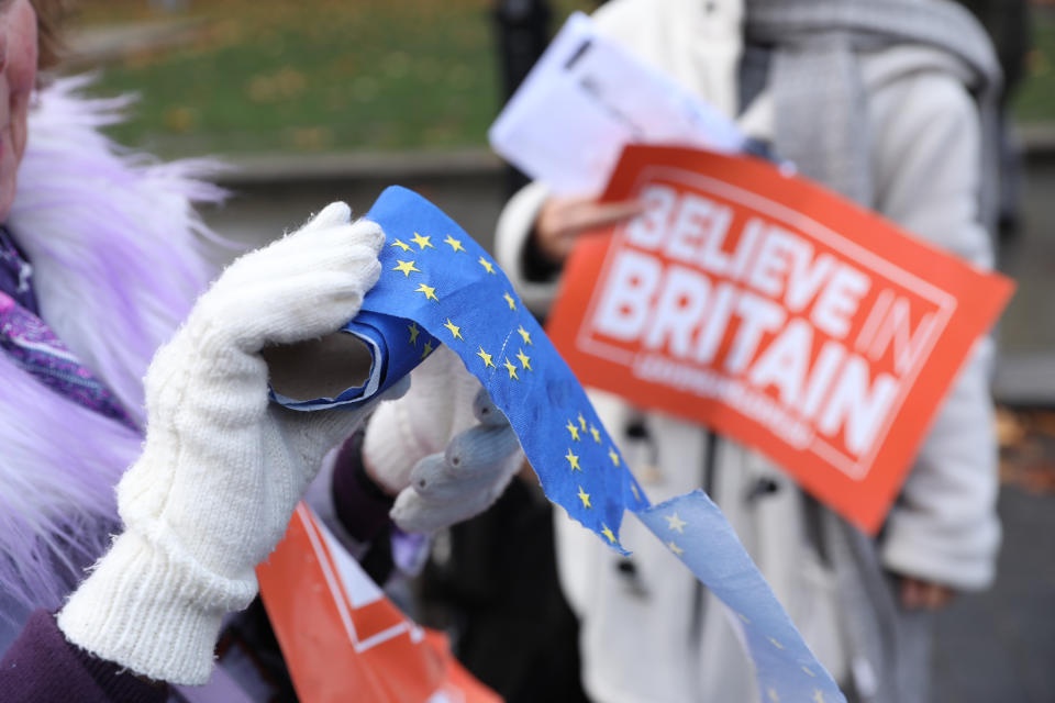 A Leave protestor holds an EU toilet roll. Photo: Isabel Infantes/EMPICS Entertainment