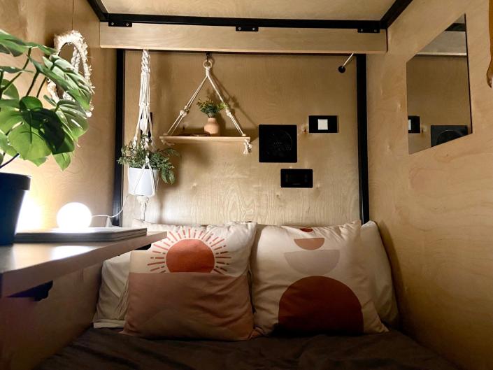 Inside a compact sleep pod in co-living house