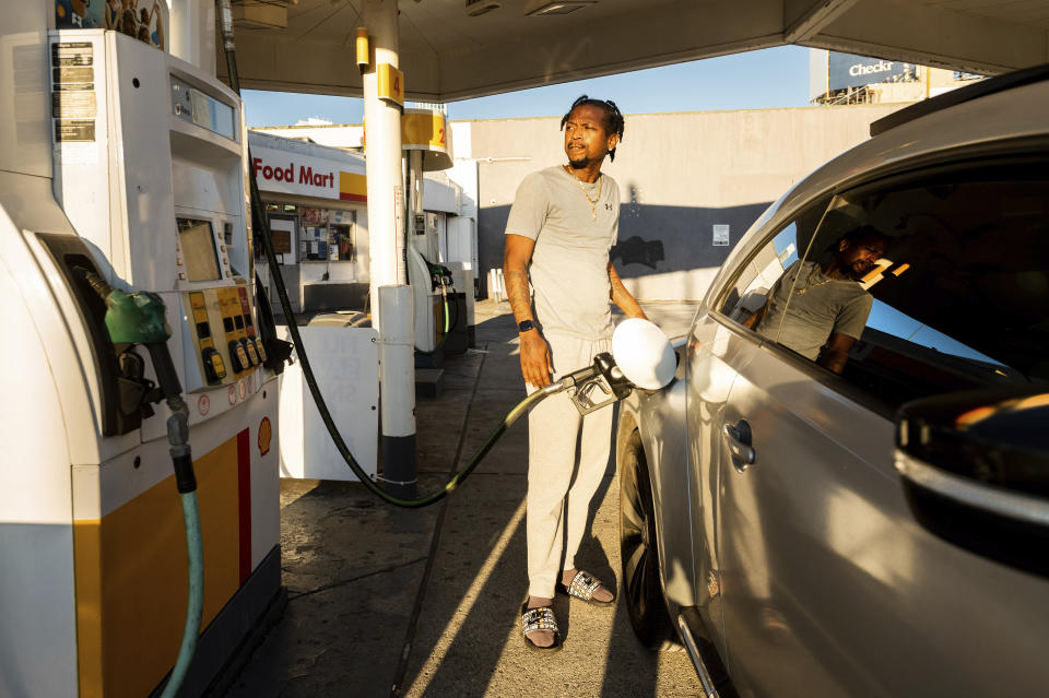 A motorist fills up at a Shell station on Monday, Nov. 22, 2021, in San Francisco, where regular unleaded gasoline was selling for $5.85 per gallon. President Joe Biden on Tuesday, Nov. 23, 2021, ordered 50 million barrels of oil released from America's strategic reserve to help bring down energy costs, in coordination with other major energy consuming nations, including India, the United Kingdom and China. (AP Photo/Noah Berger)