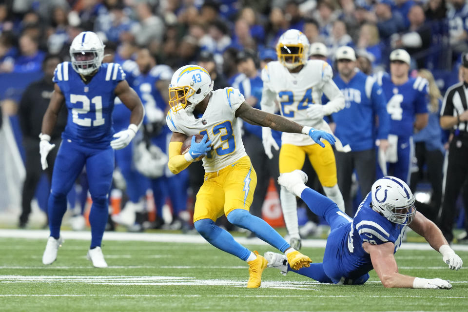 Los Angeles Chargers' Michael Davis (43) runs after an interception during the first half of an NFL football game against the Indianapolis Colts, Monday, Dec. 26, 2022, in Indianapolis. (AP Photo/Michael Conroy)