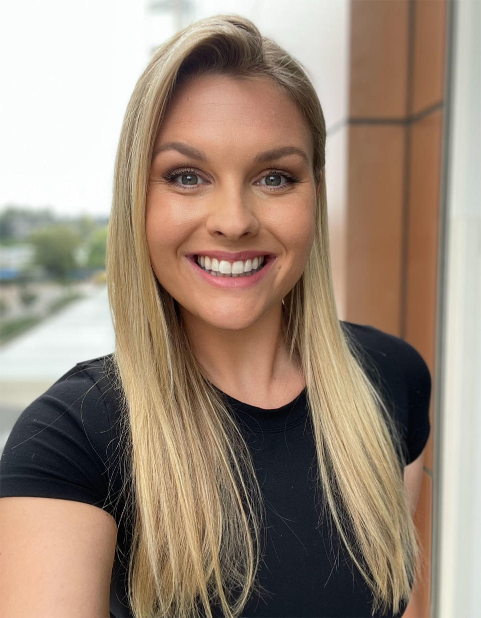 Sophie Dillman wearing a black T-shirt in a selfie