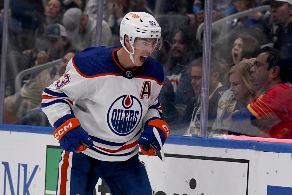 Edmonton Oilers' Ryan Nugent-Hopkins celebrates after scoring during the third period of an NHL hockey game against the St. Louis Blues Wednesday, Oct. 26, 2022, in St. Louis. (AP Photo/Jeff Roberson)