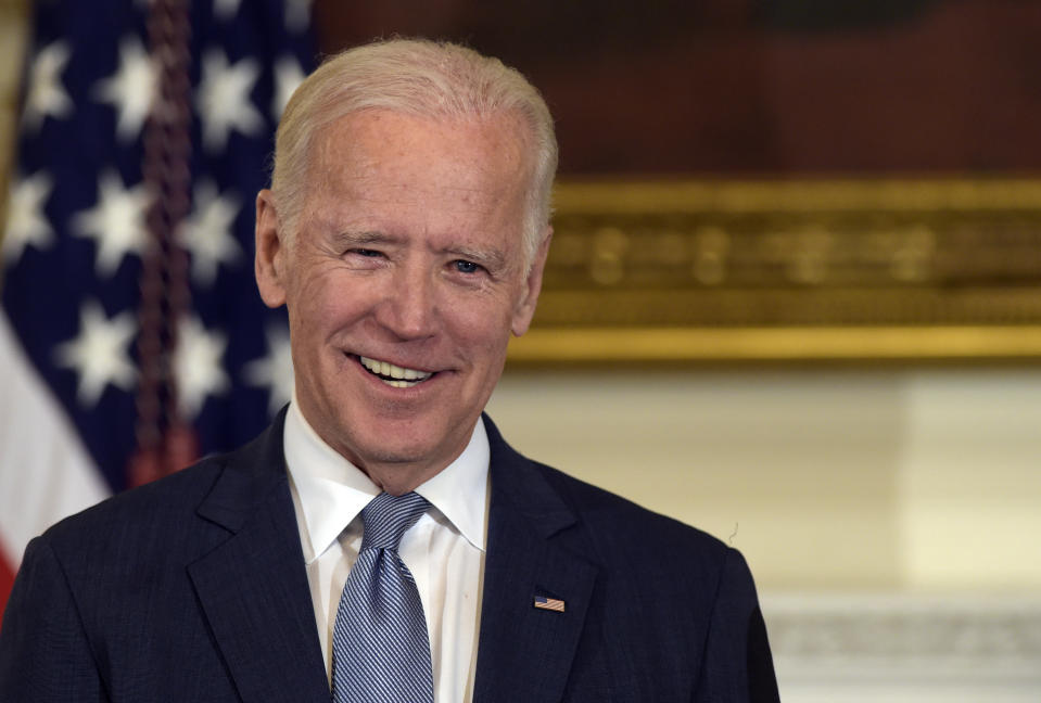 FILE - In this Jan. 12, 2017, file photo Vice President Joe Biden listens during a ceremony in the State Dining Room of the White House in Washington, where President Barack Obama presented him with the Presidential Medal of Freedom. (AP Photo/Susan Walsh, File)