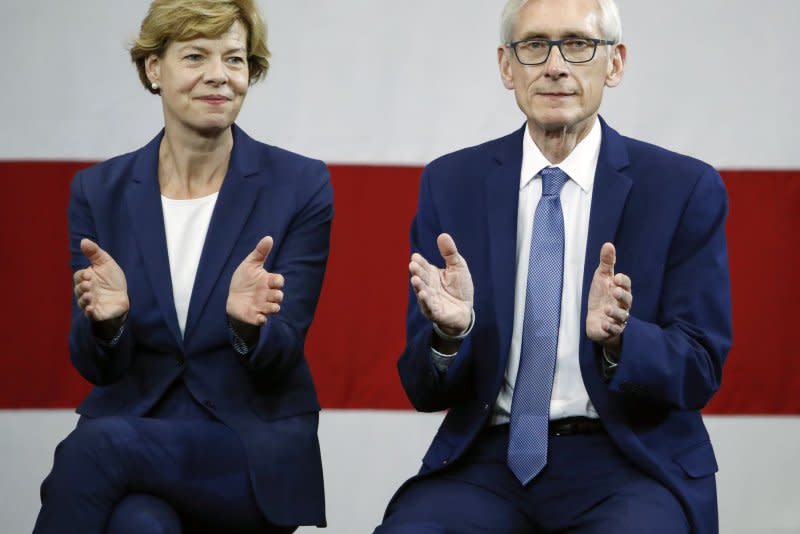 U.S. Sen. Tammy Baldwin (L), the first openly gay person ever elected to the U.S. Senate, and then-Democratic gubernatorial candidate Tony Evers (R) applaud as former President Barack Obama speaks during the campaign rally for Wisconsin Democrats, October 2018. On Tuesday, Evers said no to a bill that would have banned transgender student athlete participation based on their chosen gender. File Photo by Kamil Krzaczynski/UPI