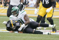 New York Jets defensive end John Franklin-Myers (91) tackles Pittsburgh Steelers quarterback Mitch Trubisky (10) during the first half of an NFL football game, Sunday, Oct. 2, 2022, in Pittsburgh. (AP Photo/Gene J. Puskar)