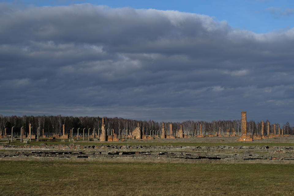 The remains of brick stone chimneys of prisoners barracks inside the former Nazi death camp of Auschwitz Birkenau or Auschwitz II. in Oswiecim, Poland, Sunday, Dec. 8, 2019. The commemorations for the victims of the Holocaust at the International Holocaust Remembrance Day, marking the liberation of Auschwitz-Birkenau on Jan. 27, 1945, will be mostly online in 2021 due to the coronavirus pandemic. (AP Photo/Markus Schreiber)