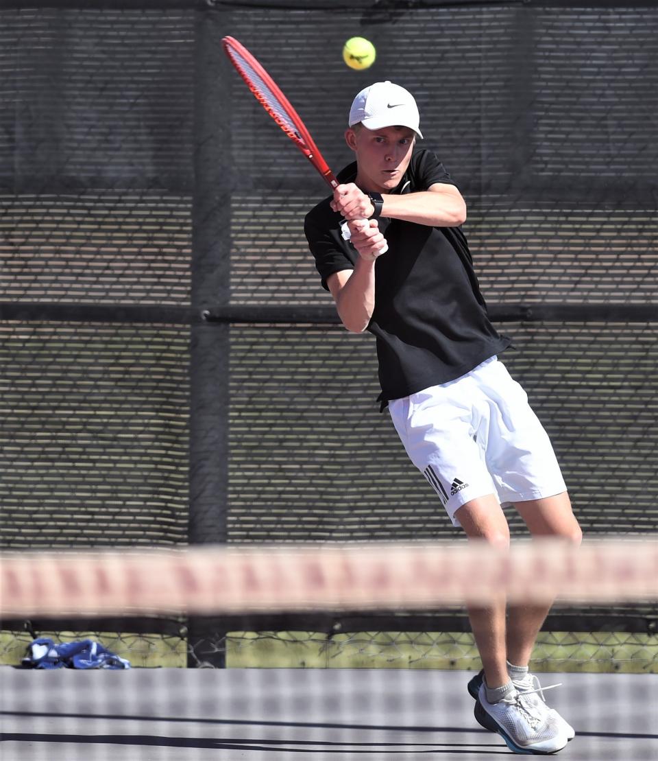 Abilene High's Griffin Sullivan chases down a shot against Wylie's Brandon Cowling in a boys singles playback match at the Region I-5A tournament Tuesday. April 11, 2023, in Lubbock. Sullivan won 6-3, 6-3 to earn his state berth.