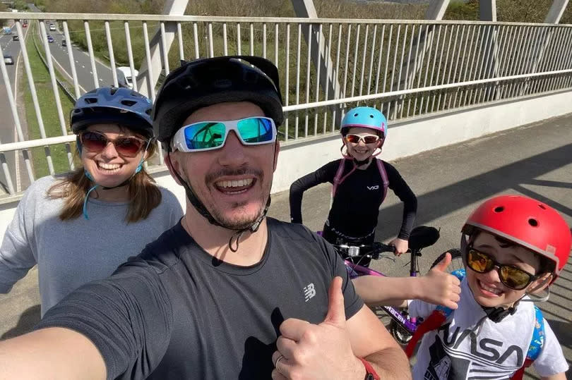 Ava Holden with her parents and brother enjoying a family bike ride