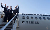 Airbus Chief Executive Tom Enders (2nd L) waves to employees as he stands on a C Series plane with Bombardier executives and other dignitaries at Bombardier's plant in Mirabel, Quebec Canada, October 20, 2017. REUTERS/Christinne Muschi