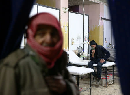 A man breathes through an oxygen mask at a medical center in Douma, Eastern Ghouta in Damascus, Syria January 22, 2018. REUTERS/Bassam Khabieh