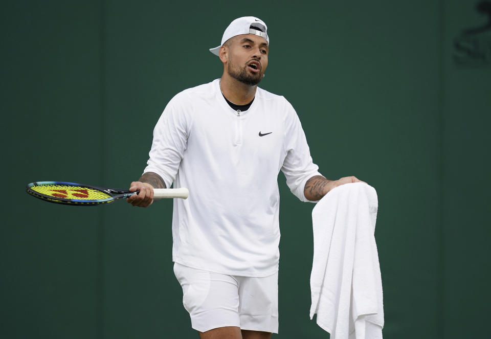 Australia's Nick Kyrgios gestures during a practice session, at the All England Lawn Tennis and Croquet Club in Wimbledon, England, Saturday July 1, 2023, ahead of the Wimbledon tennis championships which start on Monday. (John Walton/PA via AP)