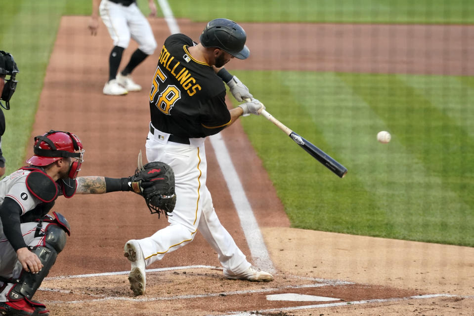 Pittsburgh Pirates' Jacob Stallings singles off Cincinnati Reds starting pitcher Wade Miley, driving in a run during the first inning of a baseball game in Pittsburgh, Tuesday, Sept. 14, 2021. (AP Photo/Gene J. Puskar)