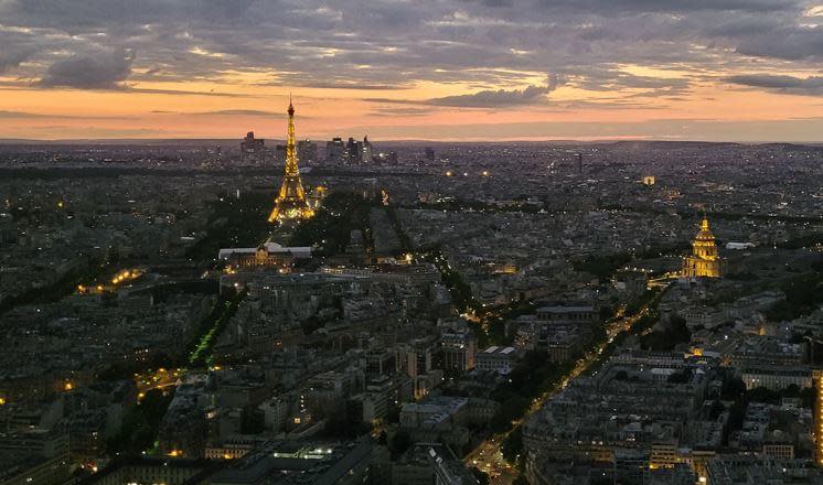 The Eiffel Tower is seen illuminated in central Paris in an August 2022 file photo. / Credit: CBS News/Tucker Reals