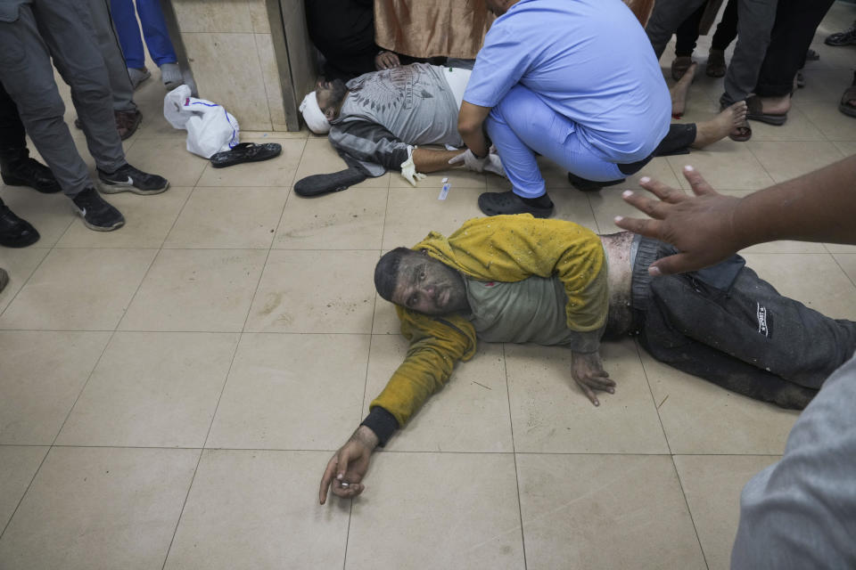 Palestinians wounded in the Israeli bombardment of the Gaza Strip are brought to the hospital in Deir al Balah on Sunday, Dec. 3, 2023. (AP Photo/ Hatem Moussa)