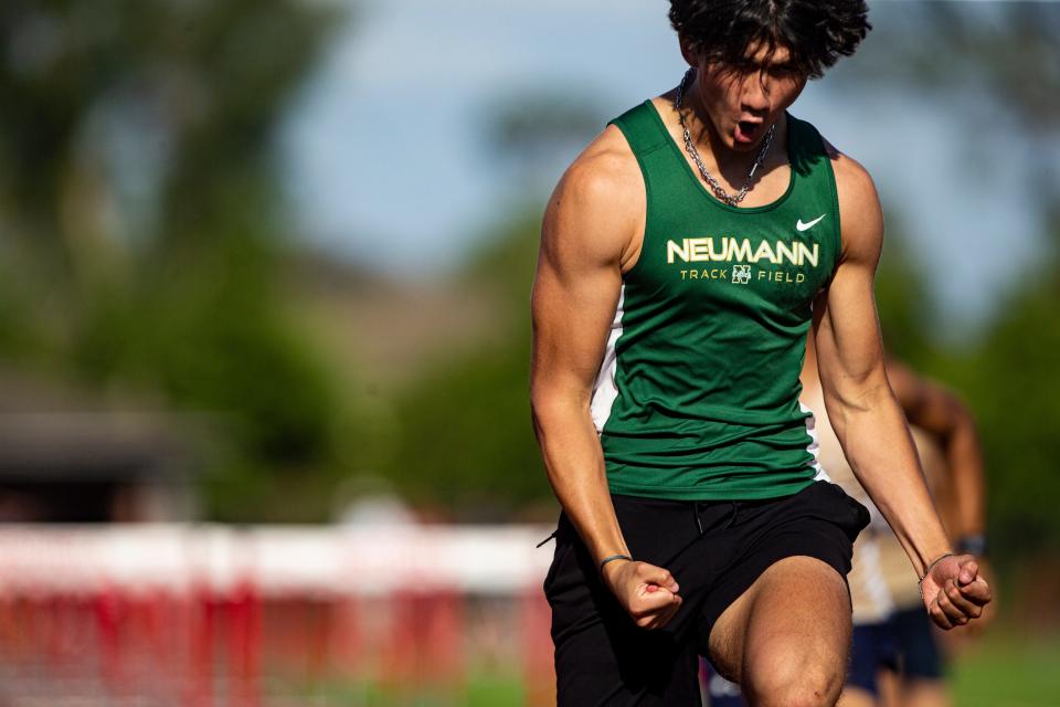 Jose-Manuel Mejia Barbery from St. John Neumann Hayden wins the 110 meter hurdles at the Class 1A-District 12 track meet at ECS.  