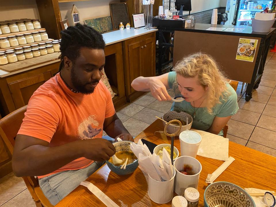 Married couple and business partners Jeremiah Isaiah and Skye Re Vera enjoy an evening ramen meal before opening Express Yo Noodle for business at the Cahawba House location Monday, May 1, 2023.
